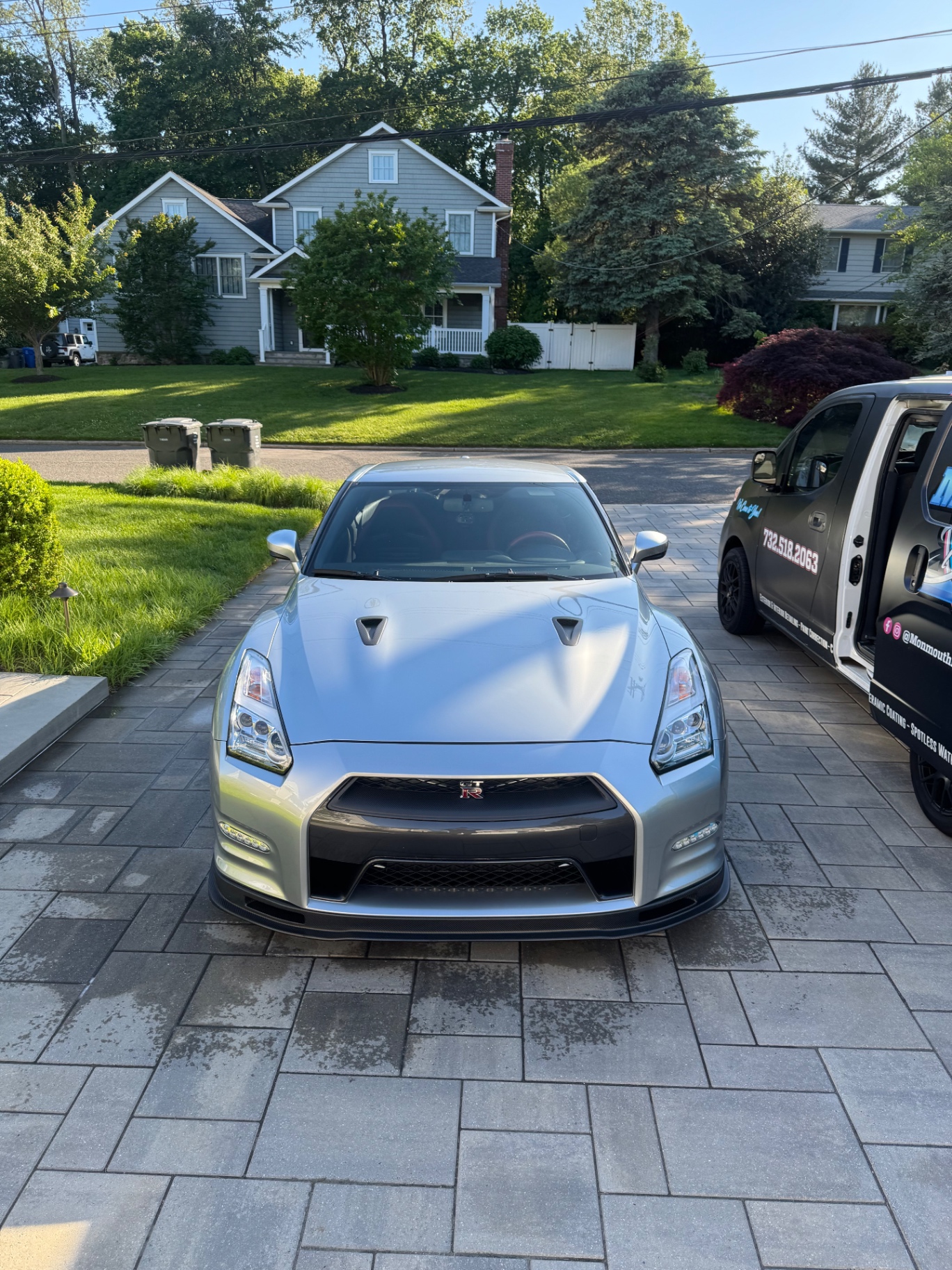 Silver Nissan GT-R mobile detail alongside the Monmouth Detail Co van in a Monmouth County, NJ driveway